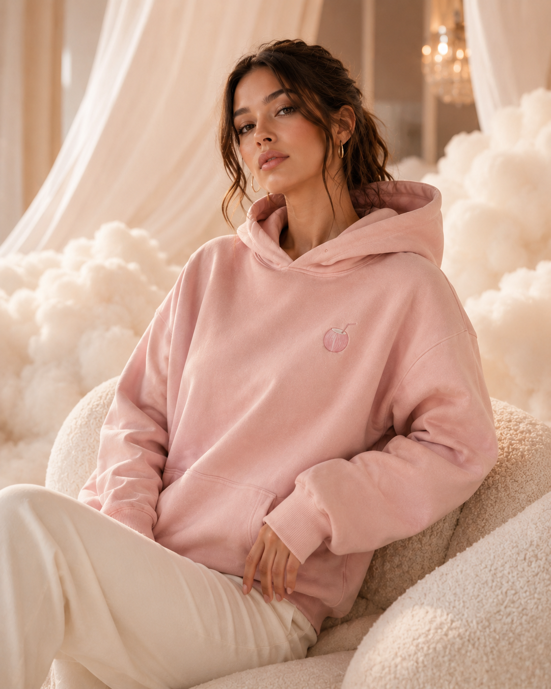 Model wearing a blush PinkyCoco Coco Clouds hoodie
