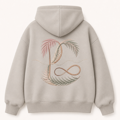 Model wearing the PinkyCoco Coastal Monogram Infinity oversized fleece hoodie
