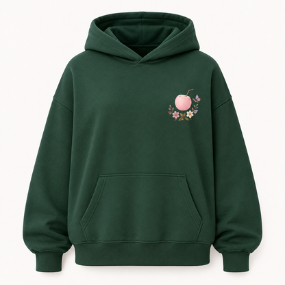 Model wearing the PinkyCoco Emerald Wildflower Butterfly oversized fleece hoodie