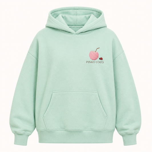 Model wearing the PinkyCoco Mint Ladybug Palm Garden oversized fleece hoodie