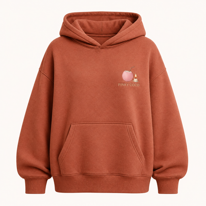 Model wearing the PinkyCoco Terracotta Candle Sun Dunes oversized fleece hoodie