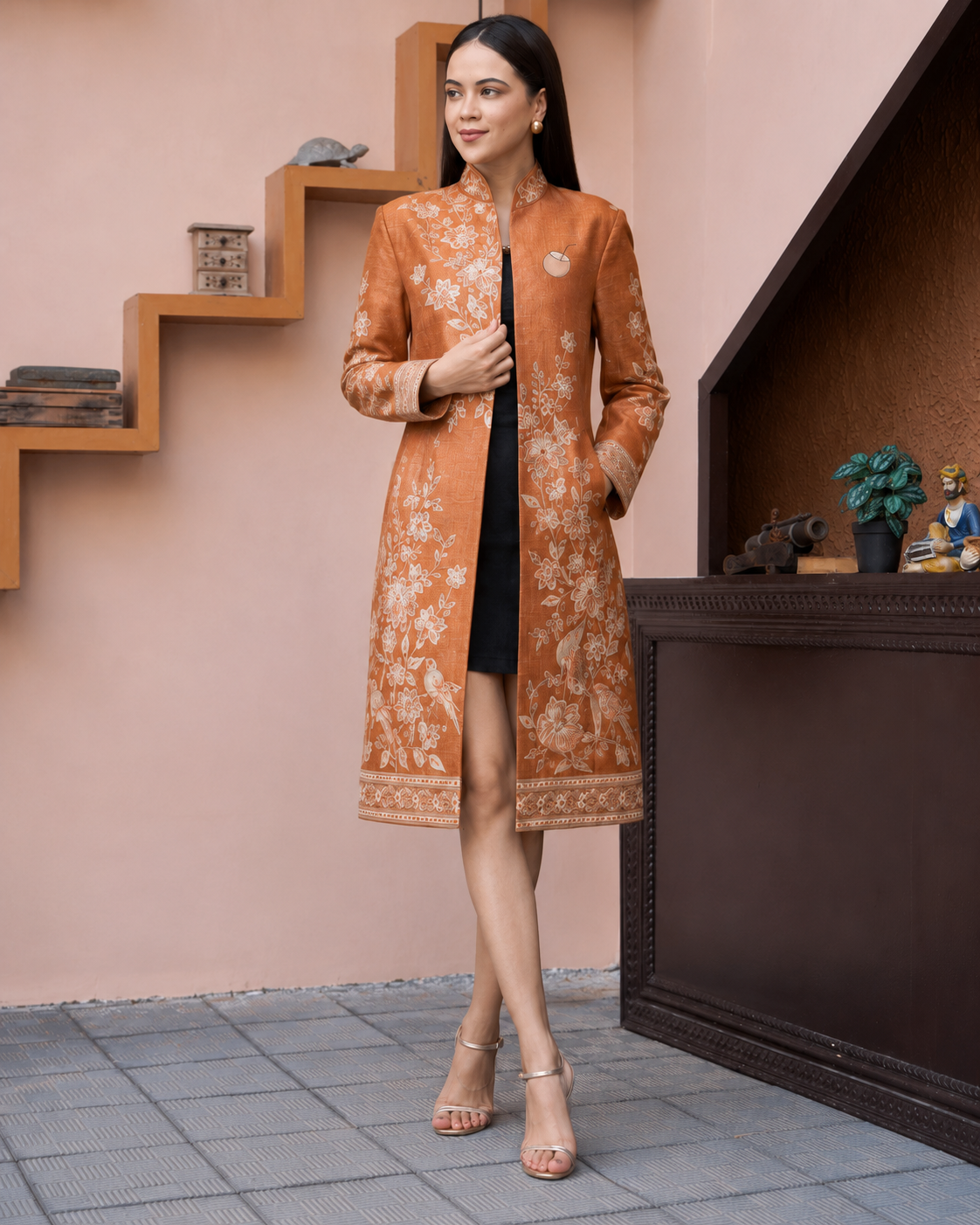 Model wearing PinkyCoco Terracotta Floral Women's Statement Coat, front view