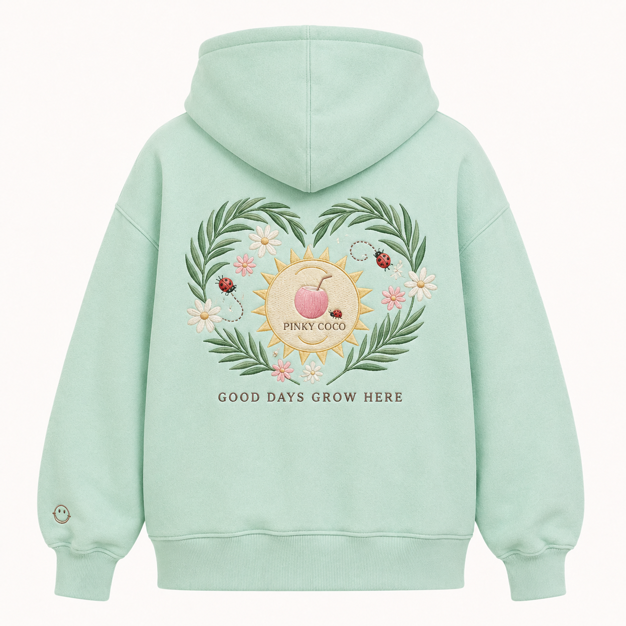 Front view of the PinkyCoco Mint Ladybug Palm Garden women's hoodie