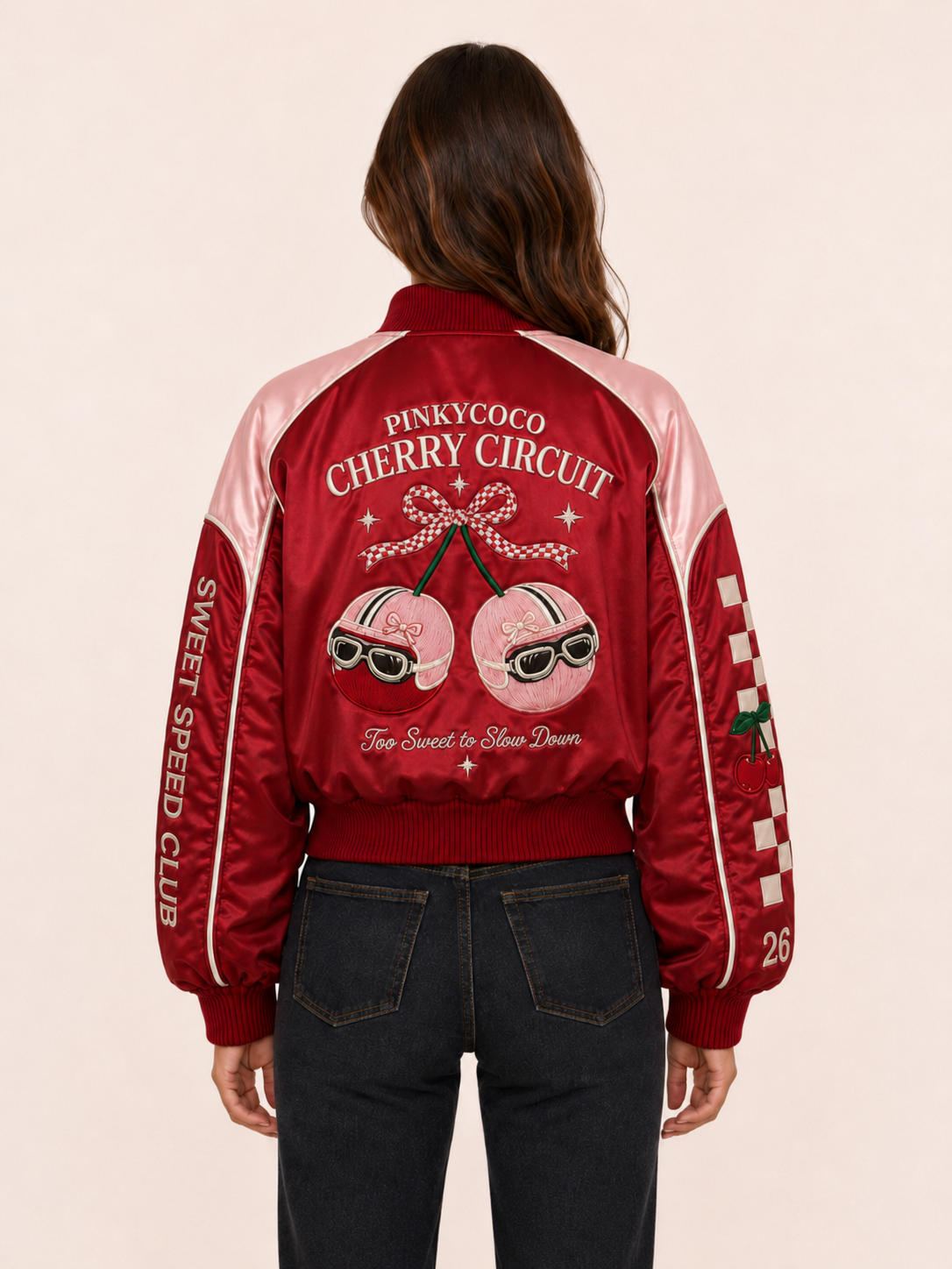Model wearing the PinkyCoco Cherry Circuit women's satin racing jacket, three-quarter view