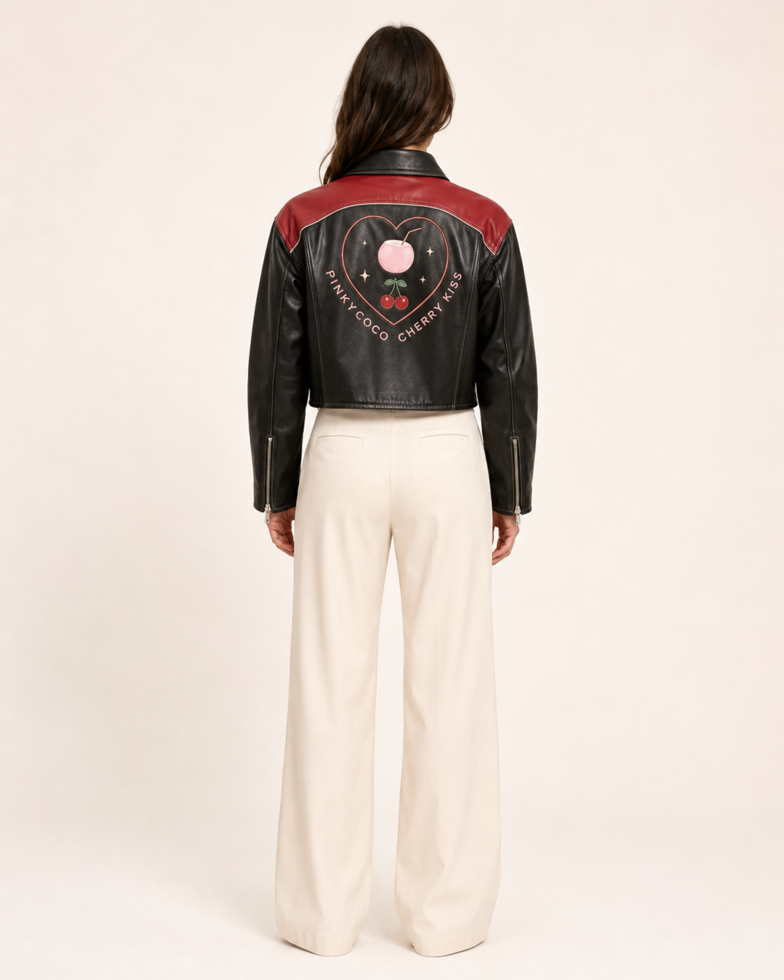 Model wearing PinkyCoco Cherry Kiss Cropped Women's Leather Fashion Jacket, three-quarter view