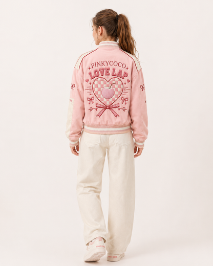 Model wearing the PinkyCoco Coco Love Lap Reversible women's satin racing jacket, three-quarter view