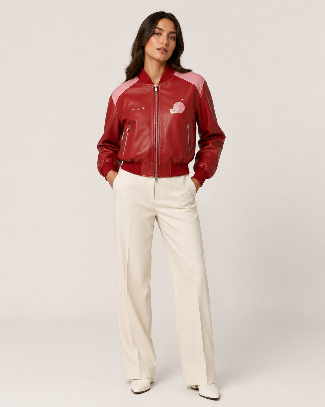 Model wearing PinkyCoco Coco Love Letter Women's Satin Bomber Jacket, three-quarter view