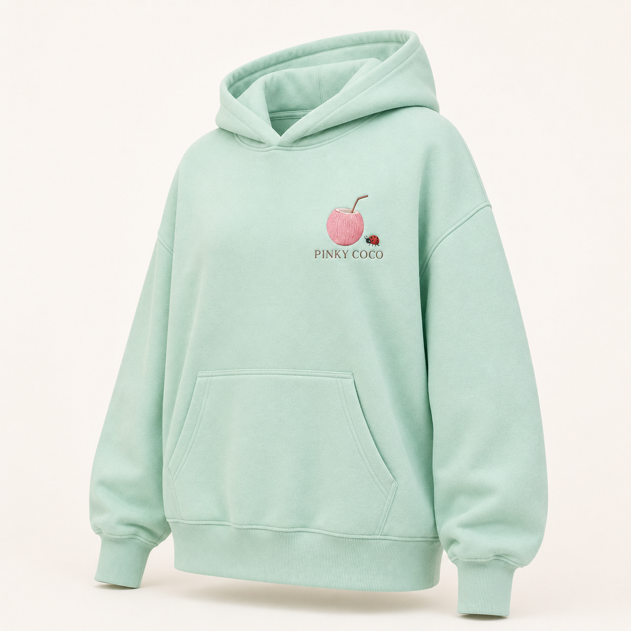 Three-quarter view of the PinkyCoco Mint Ladybug Palm Garden women's hoodie