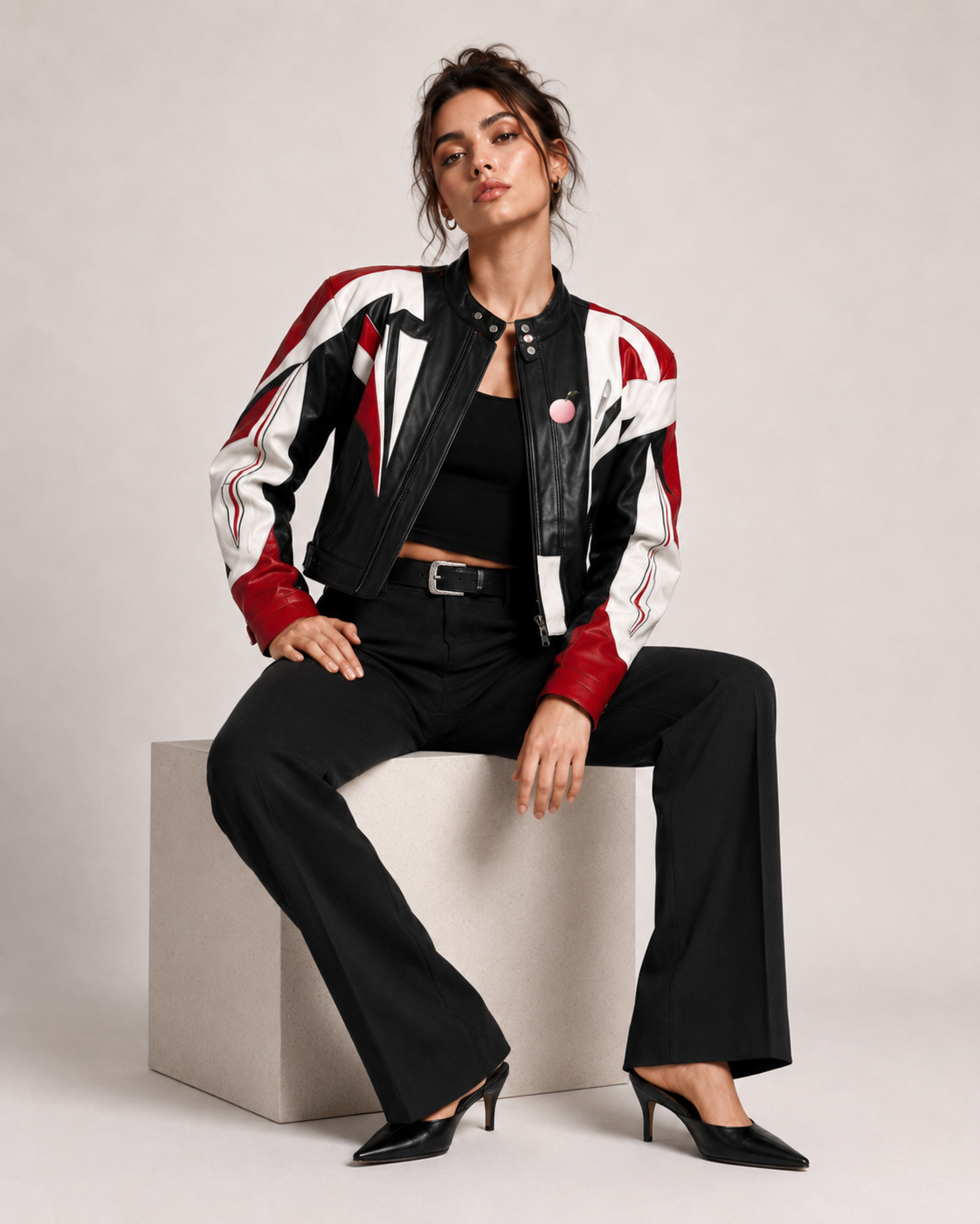 Model wearing the PinkyCoco Red Black Wing women's racing jacket, three-quarter view
