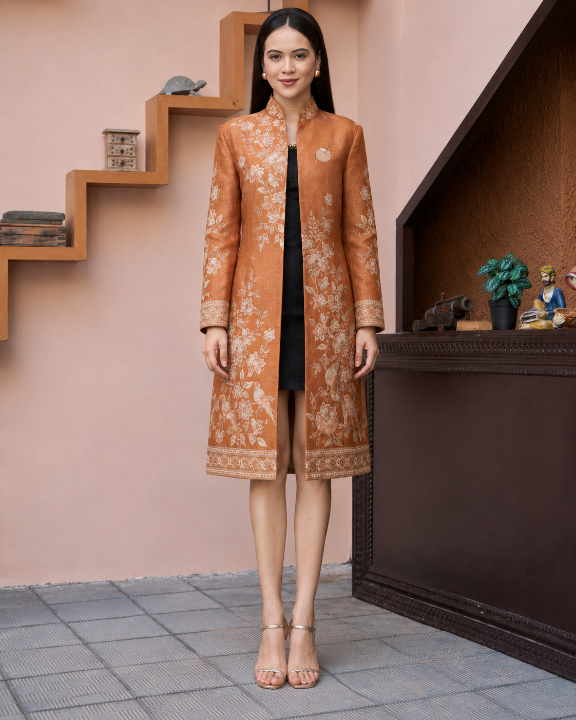 Model wearing PinkyCoco Terracotta Floral Women's Statement Coat, three-quarter view