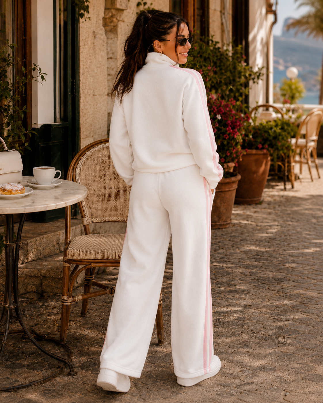 Three-quarter model view of the PinkyCoco White Pinkstripe Coco women's matching fleece lounge set