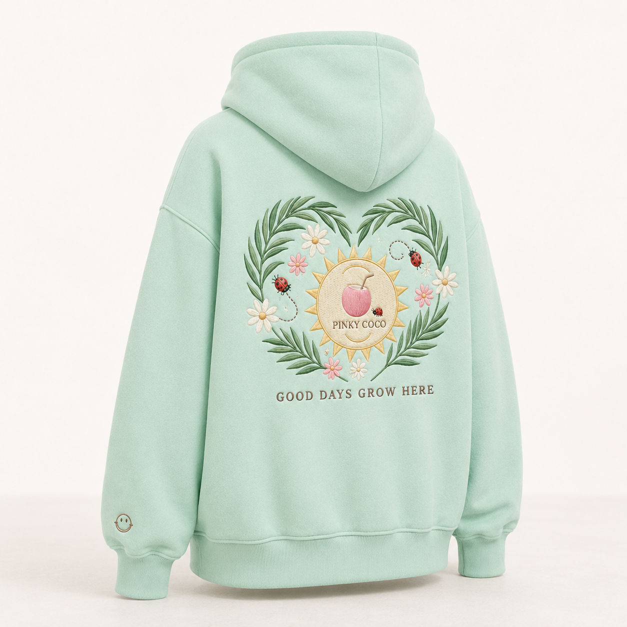 Back view of the PinkyCoco Mint Ladybug Palm Garden oversized fleece hoodie