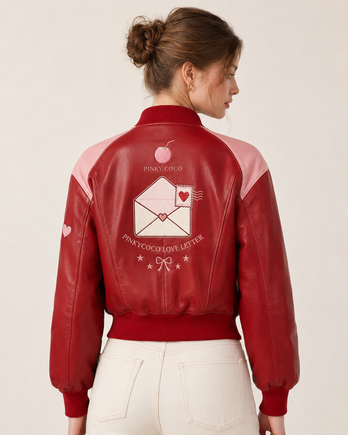 Model wearing PinkyCoco Coco Love Letter Women's Satin Bomber Jacket, back view