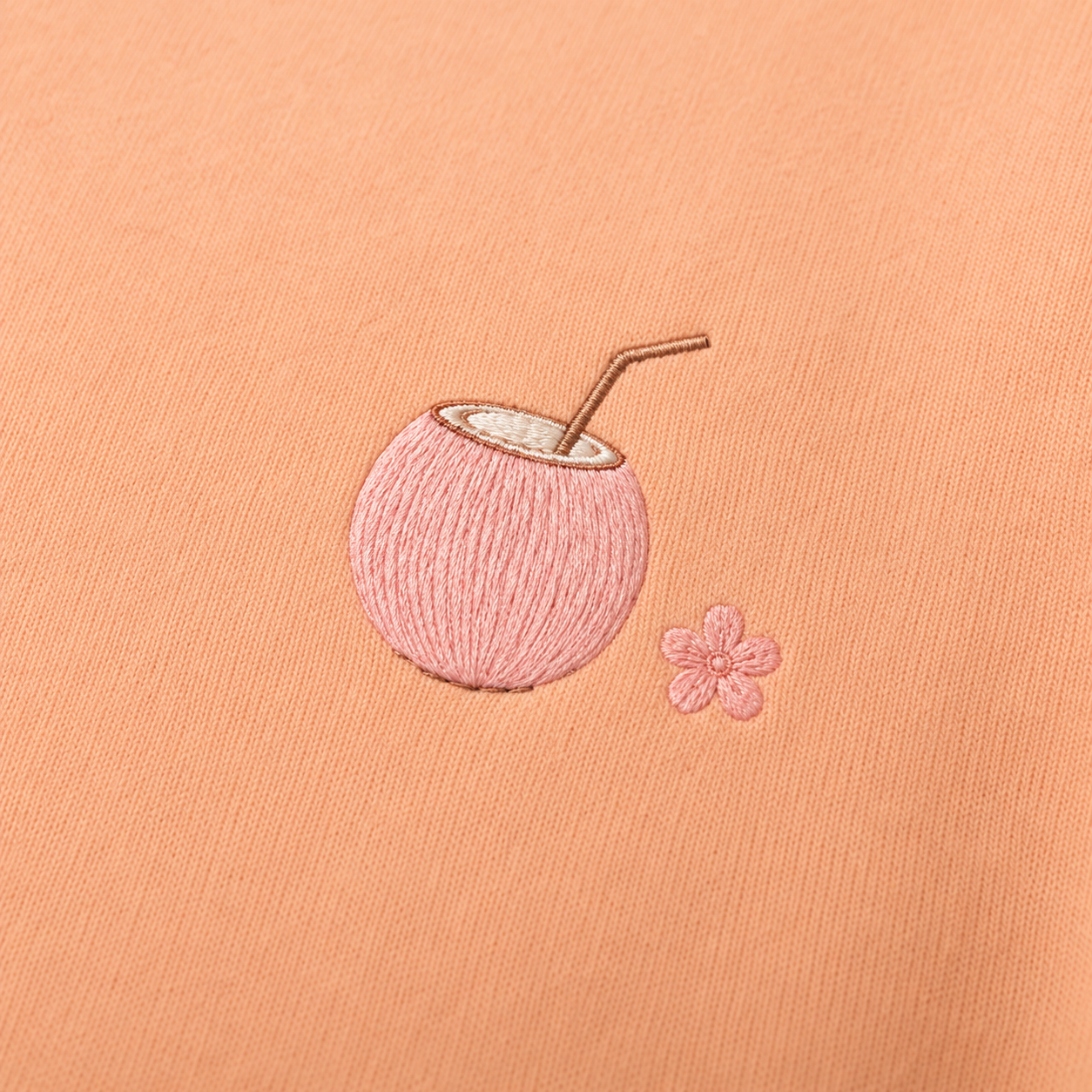 Model showing the back of the PinkyCoco Sun Kissed Blossom Beach hoodie