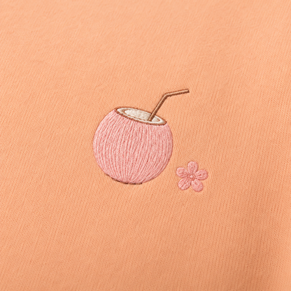 Model showing the back of the PinkyCoco Sun Kissed Blossom Beach hoodie
