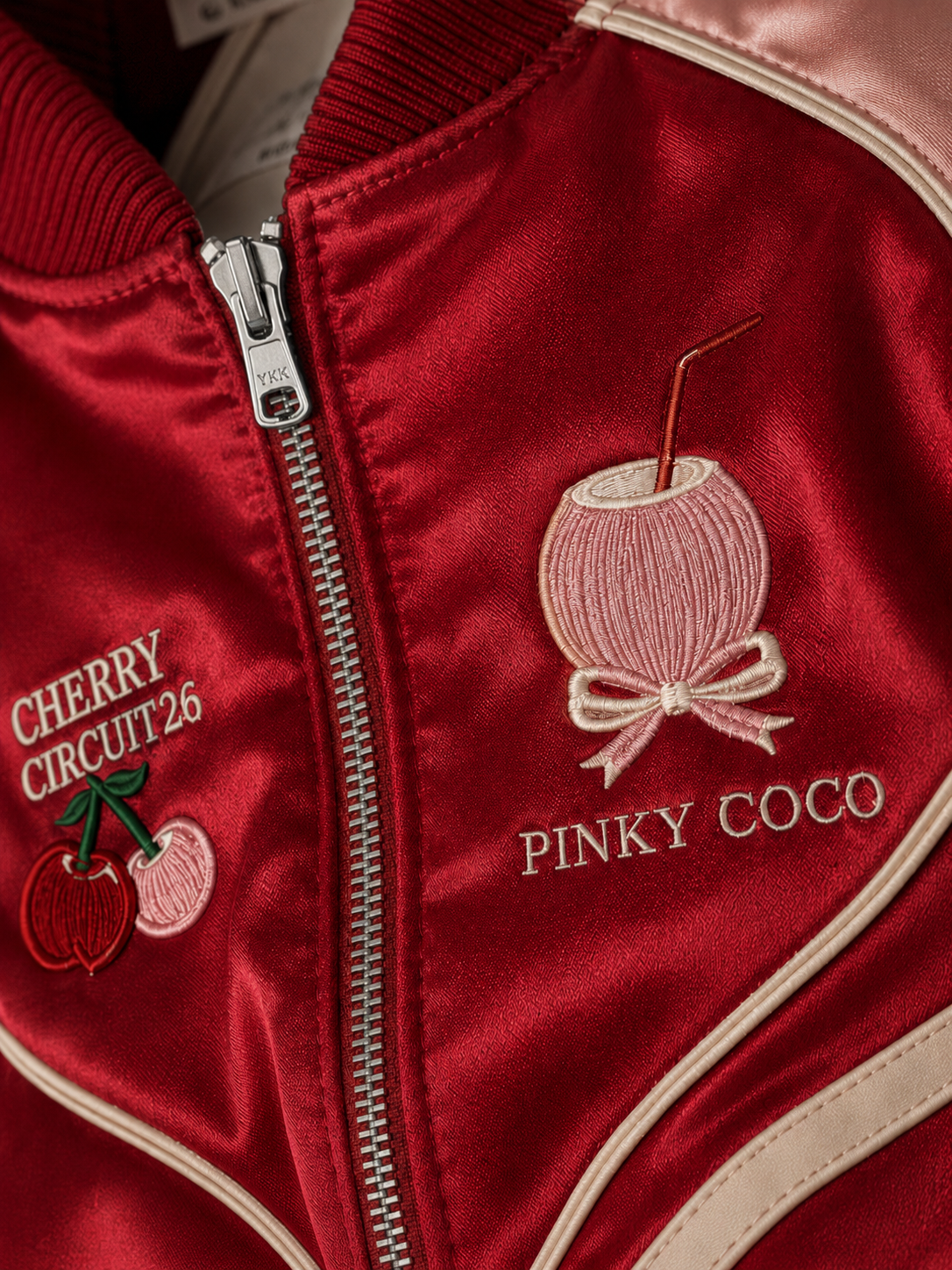 Close-up of the PinkyCoco Cherry Circuit women's satin racing artwork