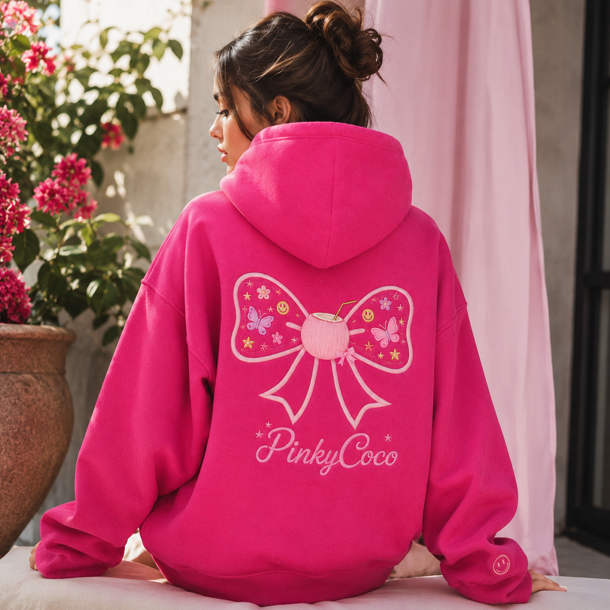 Detail of the hood, cuffs and stitching on the PinkyCoco Magenta Bow Pop Garden hoodie