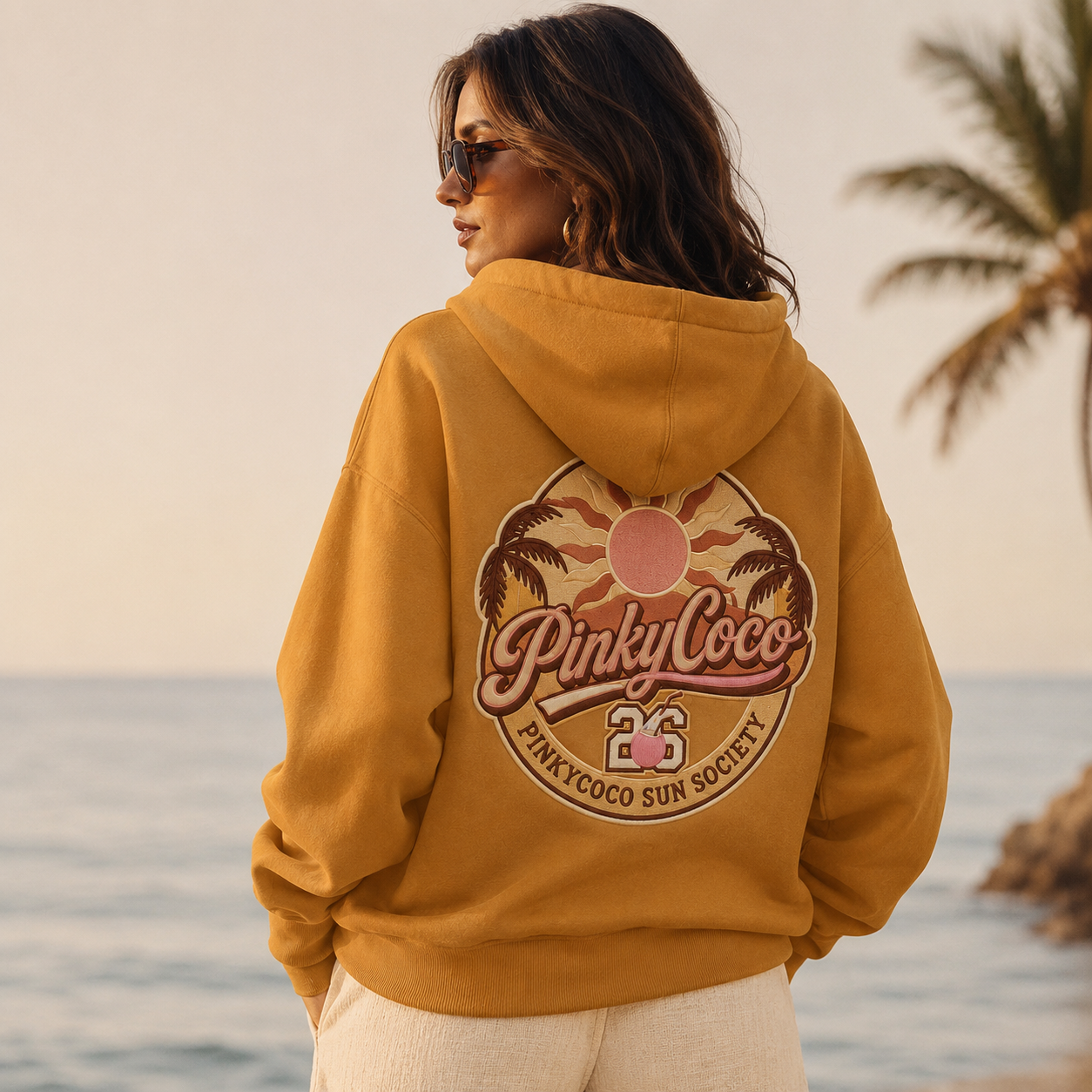 Detail of the hood, cuffs and stitching on the PinkyCoco Mustard Retro Sun Society hoodie
