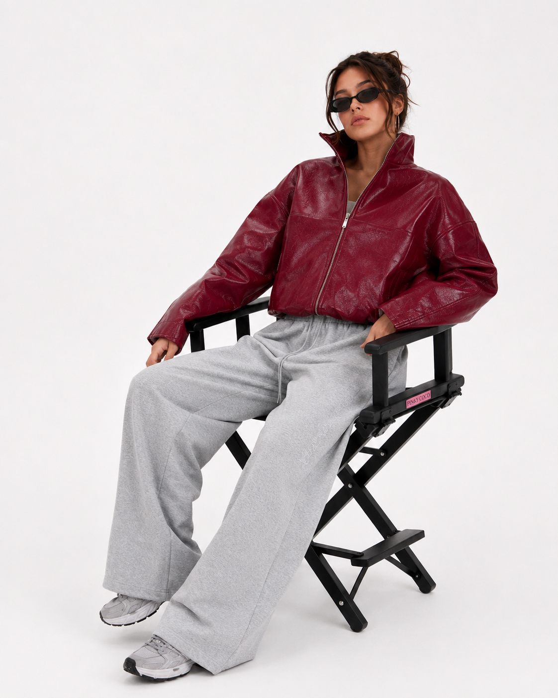PinkyCoco Cherry Noir women's burgundy leather jacket seated lifestyle view