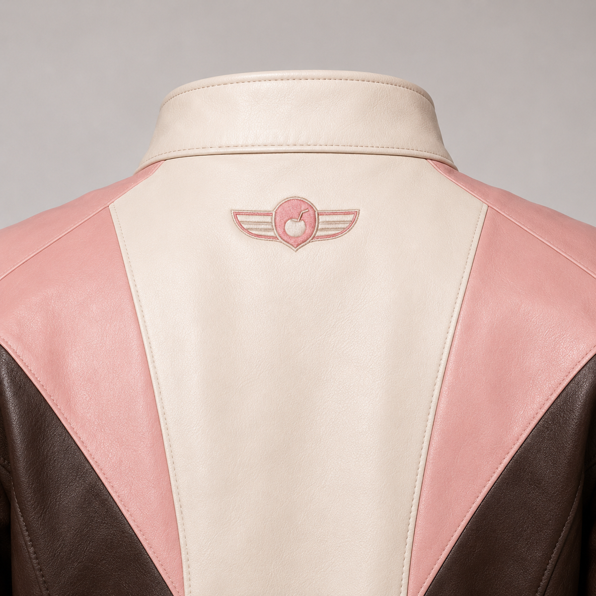 PinkyCoco Coconut Blush jacket back winged coconut emblem close-up