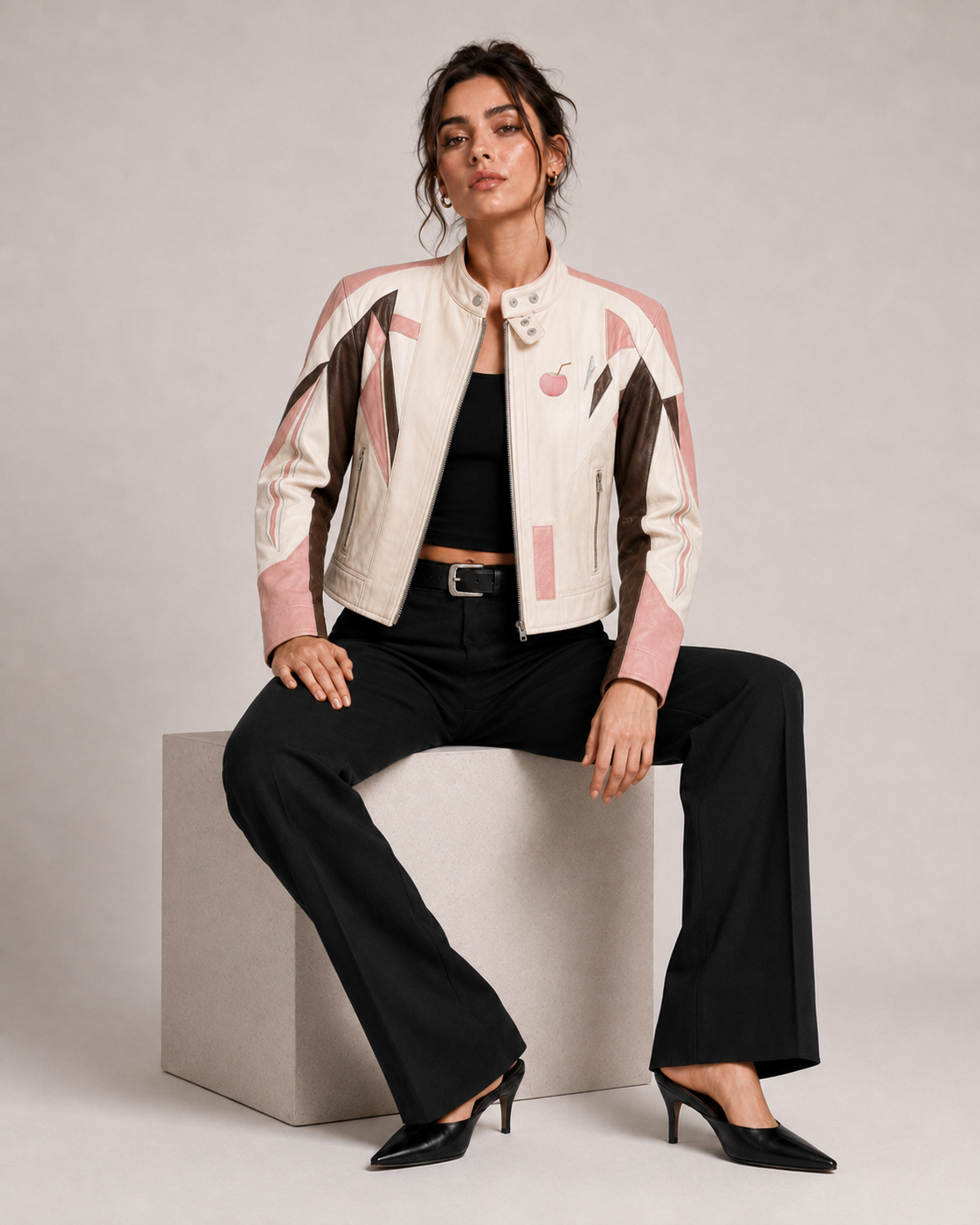 PinkyCoco Coconut Blush women's off-white leather jacket seated lifestyle view