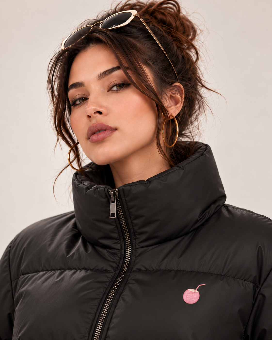 PinkyCoco Funnel puffer jacket high collar zipper and chest logo close-up